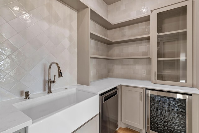 bar featuring wine cooler and sink