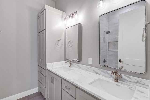 bathroom with vanity and a shower