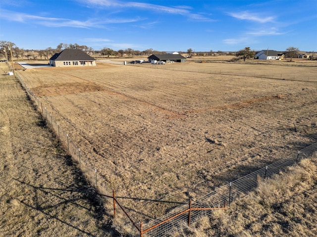 view of yard with a rural view