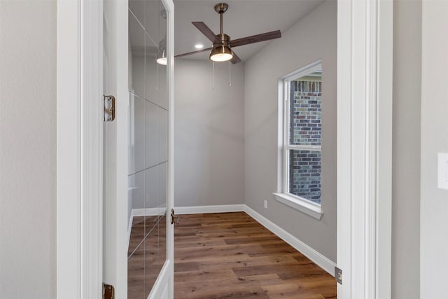 unfurnished room featuring hardwood / wood-style floors and ceiling fan