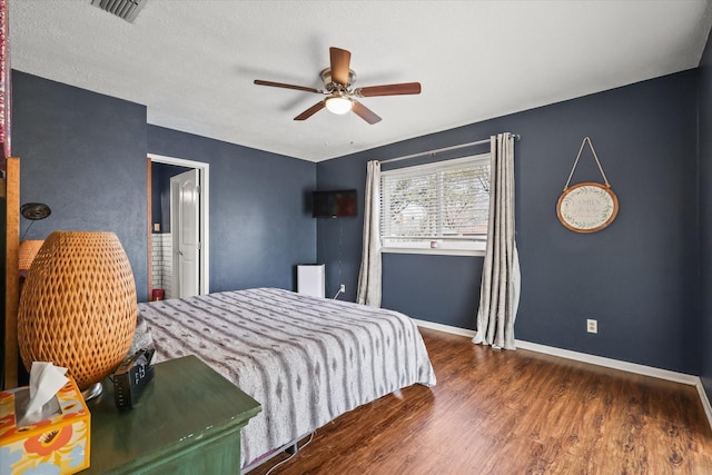 bedroom featuring dark hardwood / wood-style floors and ceiling fan