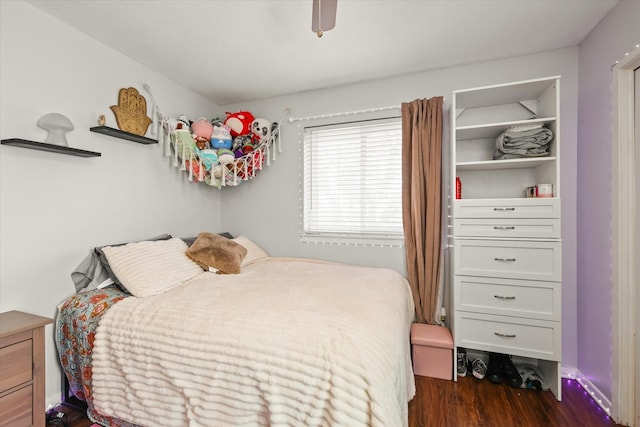 bedroom featuring dark wood-type flooring and ceiling fan