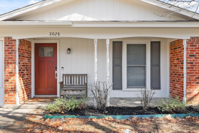 doorway to property featuring a porch