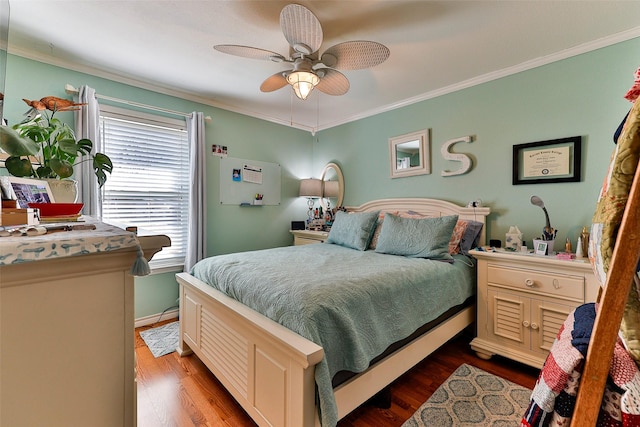 bedroom with hardwood / wood-style flooring, ceiling fan, and ornamental molding