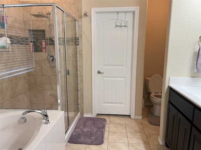 full bathroom with vanity, toilet, independent shower and bath, and tile patterned flooring