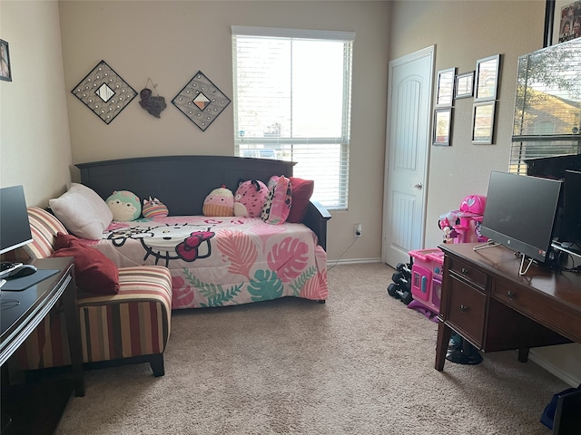 bedroom with light colored carpet