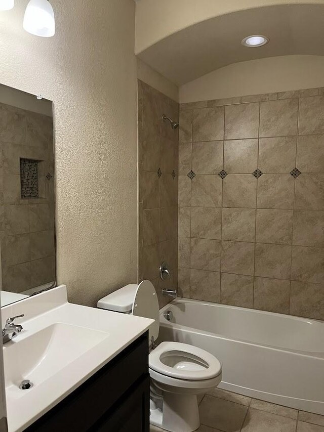 14125 Rabbit Brush Ln, Fort Worth, TX 76052 - full bath featuring toilet, washtub / shower combination, vanity, a textured wall, and tile patterned floors