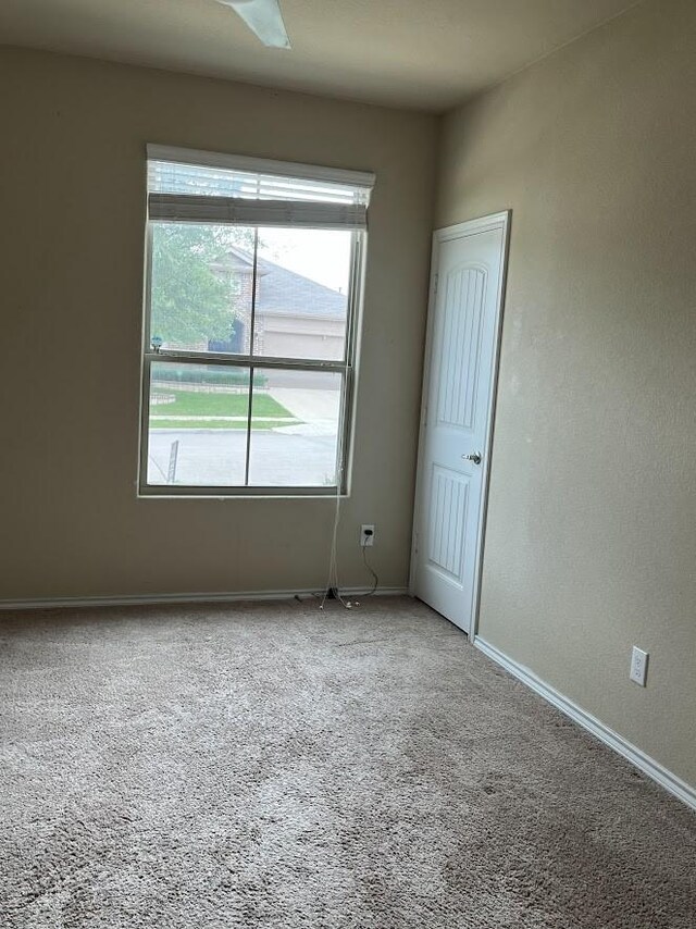 14125 Rabbit Brush Ln, Fort Worth, TX 76052 - spare room with baseboards and carpet flooring