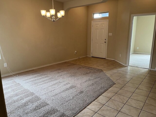 14125 Rabbit Brush Ln, Fort Worth, TX 76052 - empty room featuring light tile patterned floors, a chandelier, baseboards, and light carpet