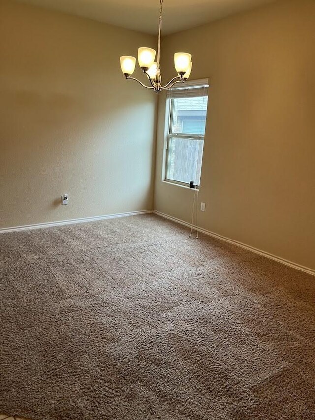 14125 Rabbit Brush Ln, Fort Worth, TX 76052 - spare room with a chandelier, baseboards, and carpet
