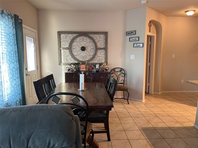 14125 Rabbit Brush Ln, Fort Worth, TX 76052 - dining room with light tile patterned floors, baseboards, and arched walkways