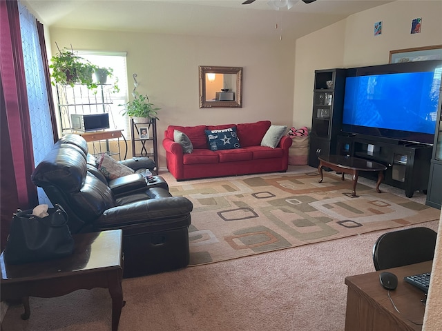 carpeted living room with ceiling fan