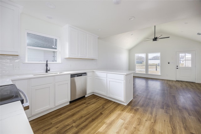 kitchen featuring stainless steel appliances, sink, white cabinets, and kitchen peninsula