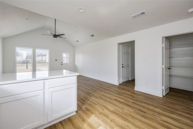 interior space featuring lofted ceiling, light hardwood / wood-style flooring, and ceiling fan