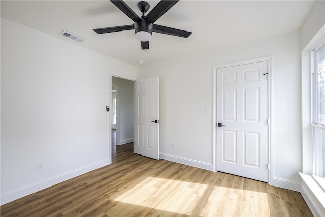 unfurnished bedroom with light hardwood / wood-style floors and ceiling fan