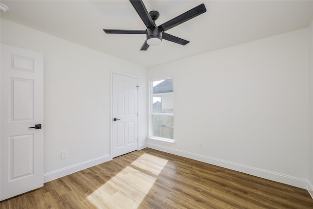 spare room featuring hardwood / wood-style flooring and ceiling fan