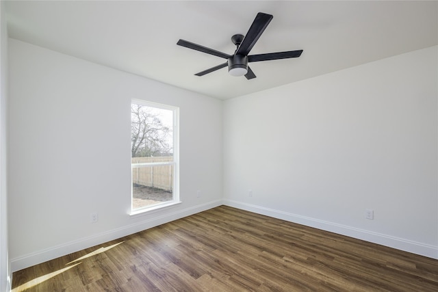 spare room featuring hardwood / wood-style floors and ceiling fan