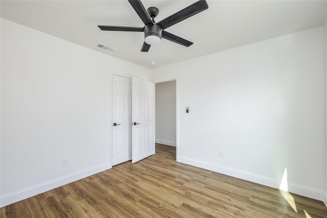 unfurnished bedroom with light hardwood / wood-style floors and ceiling fan