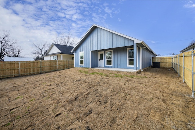 rear view of property featuring central AC unit and a patio