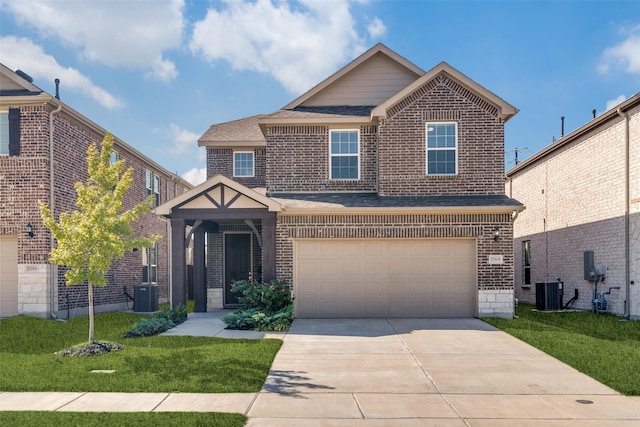 craftsman-style home featuring a garage, central AC, and a front yard