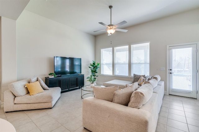 tiled living room featuring ceiling fan