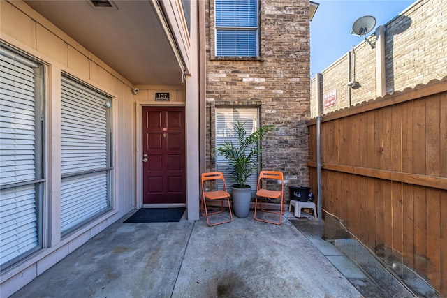 property entrance with a patio