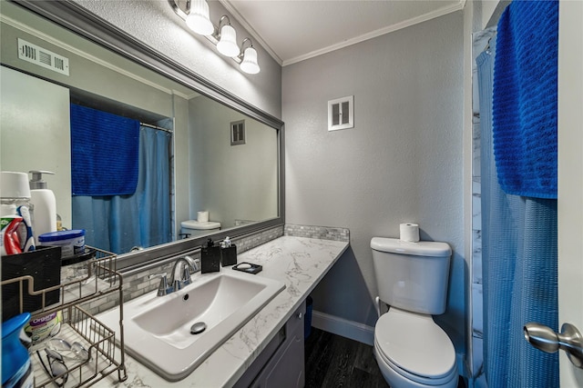 bathroom featuring toilet, crown molding, a shower with curtain, vanity, and hardwood / wood-style flooring