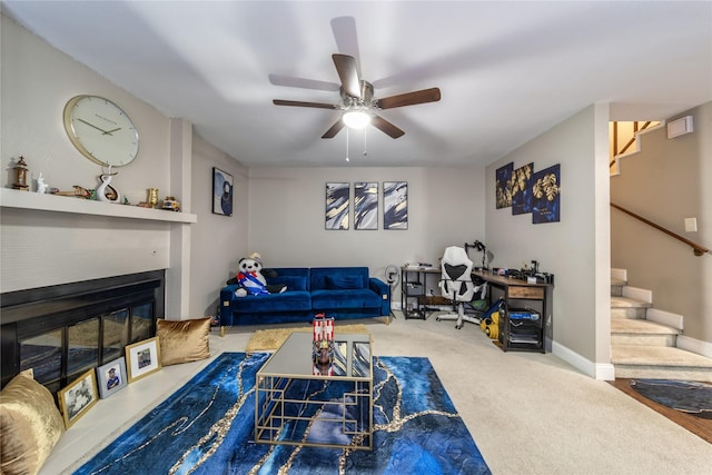 living room with carpet floors and ceiling fan