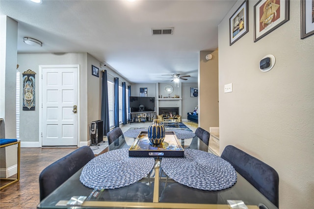 dining room with ceiling fan and hardwood / wood-style floors