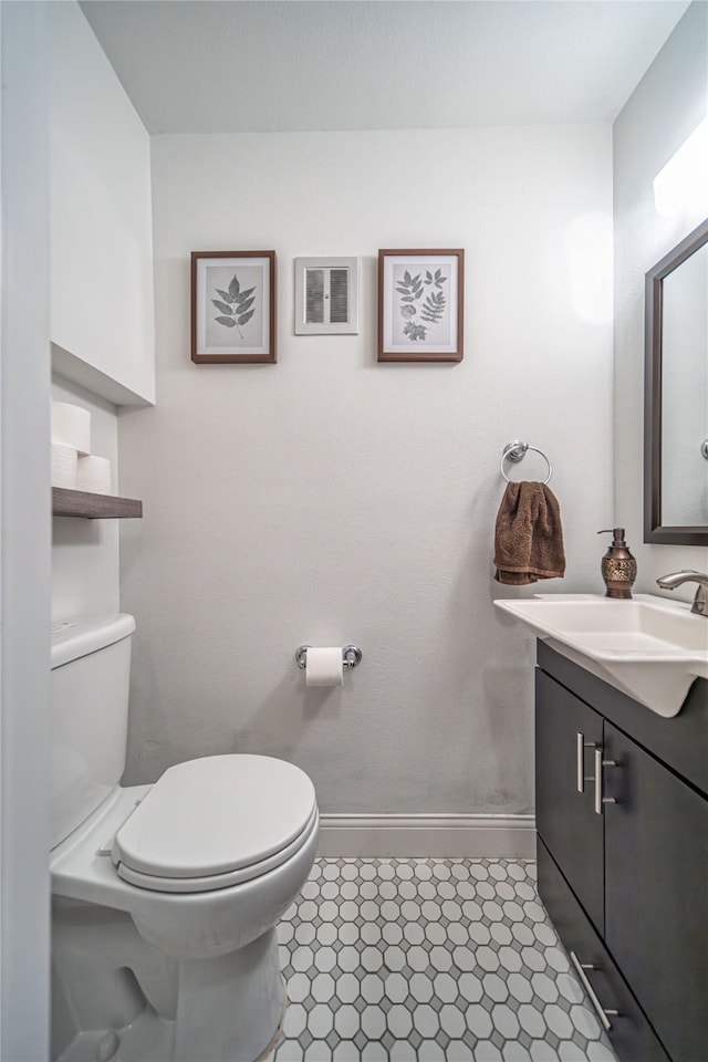 bathroom with vanity and toilet