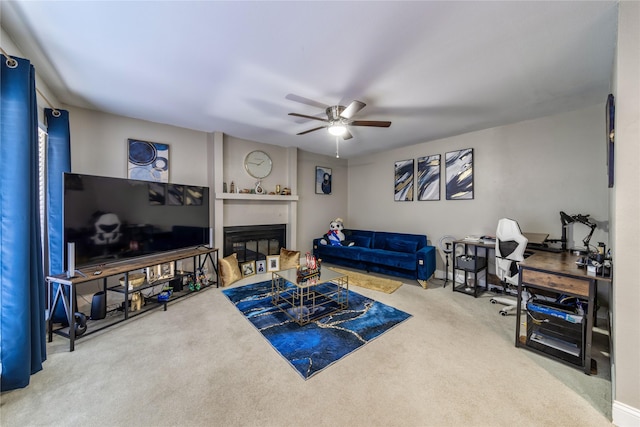 carpeted living room with ceiling fan