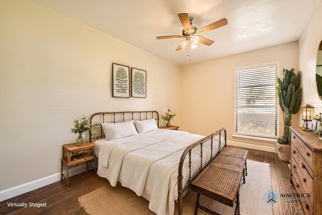 bedroom featuring dark hardwood / wood-style floors and ceiling fan