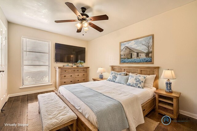 bedroom with dark wood-type flooring and ceiling fan