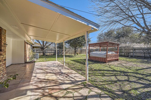 view of patio with a hot tub and central air condition unit