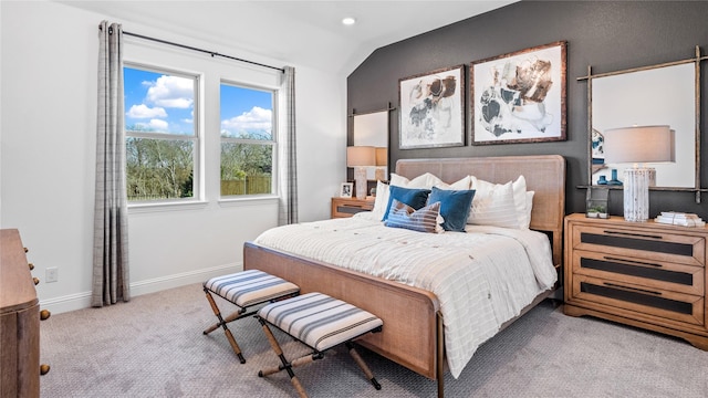 carpeted bedroom with vaulted ceiling