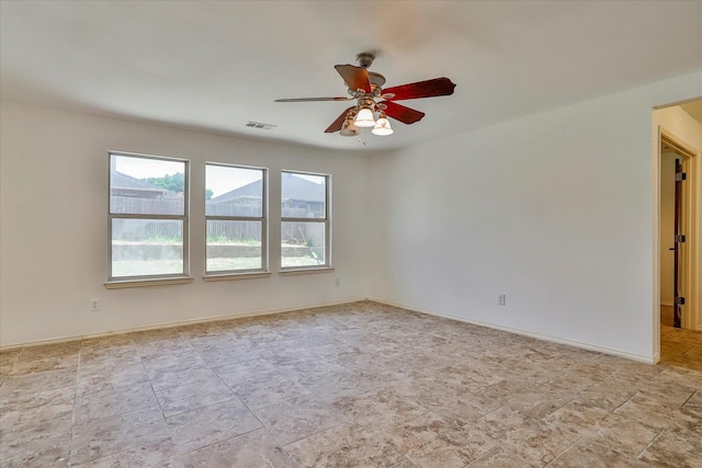 spare room with ceiling fan