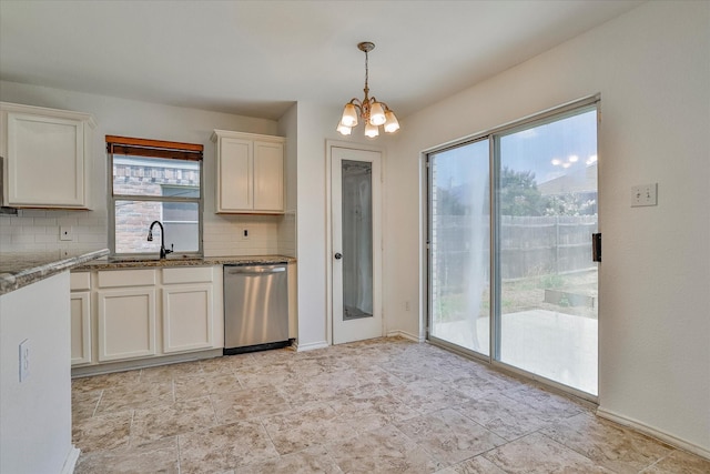 kitchen with sink, stone countertops, a chandelier, stainless steel dishwasher, and decorative backsplash