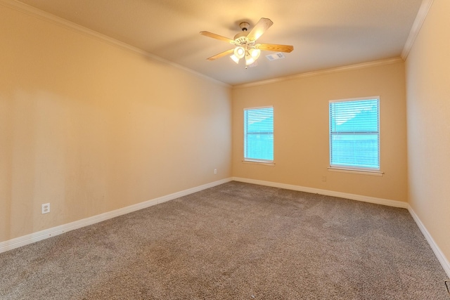 spare room with ornamental molding, carpet floors, and ceiling fan