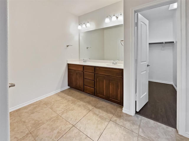 bathroom with tile patterned floors and vanity