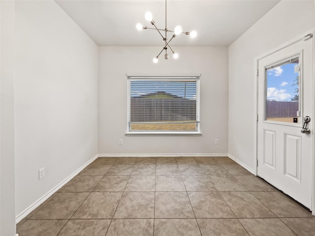 unfurnished dining area with tile patterned floors and a chandelier