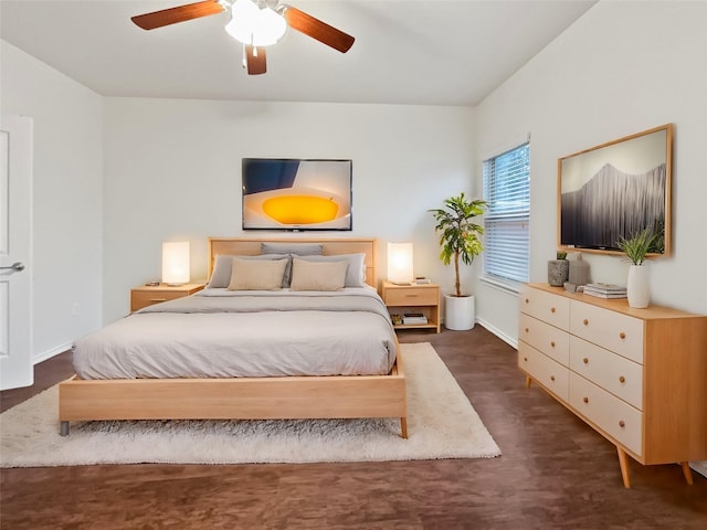 bedroom featuring dark wood-type flooring and ceiling fan