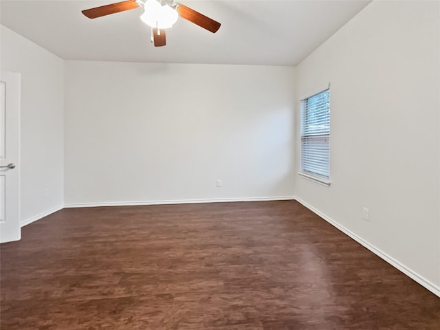 unfurnished room with dark wood-type flooring and ceiling fan