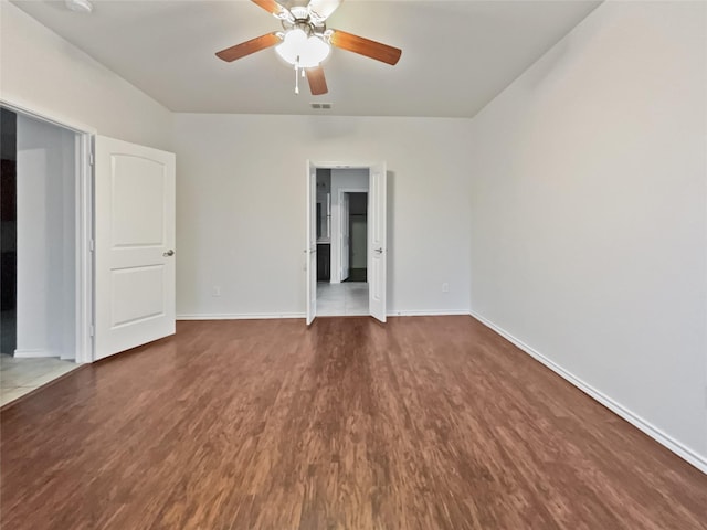 empty room featuring hardwood / wood-style flooring and ceiling fan