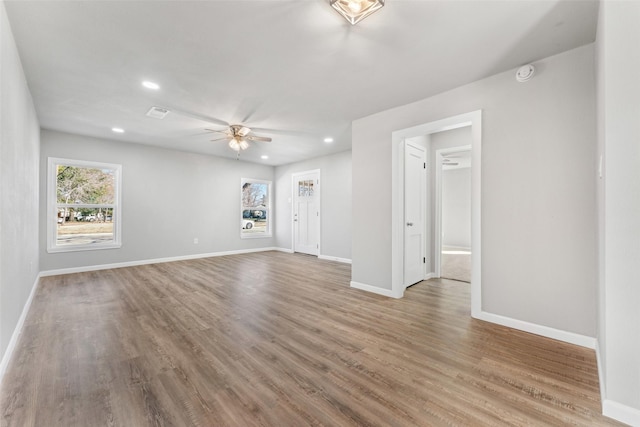 spare room featuring wood-type flooring and ceiling fan