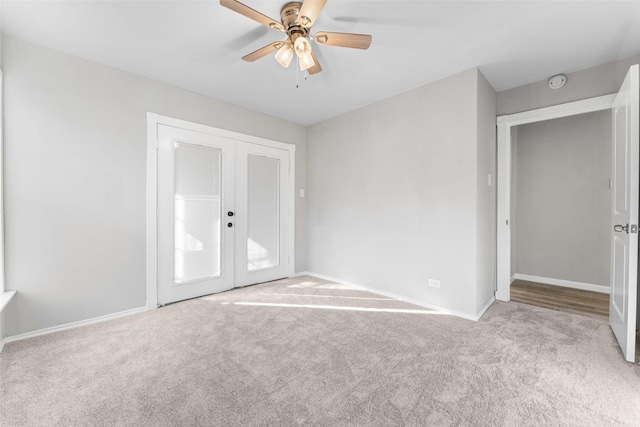 unfurnished bedroom with french doors, ceiling fan, and light carpet