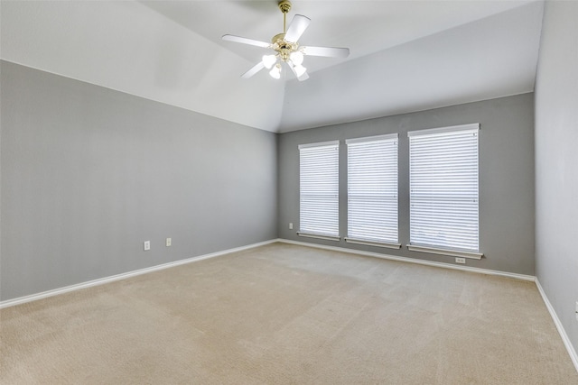 carpeted empty room with lofted ceiling and ceiling fan