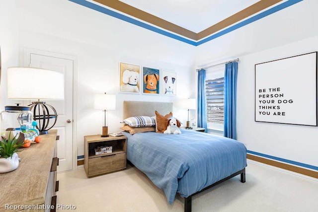 bedroom with light colored carpet