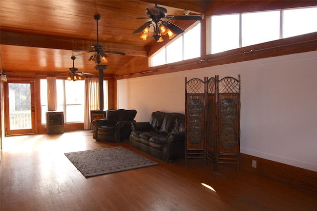 living room with wood-type flooring, high vaulted ceiling, wooden ceiling, a wood stove, and ceiling fan