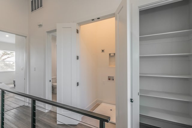 hallway with dark wood-type flooring