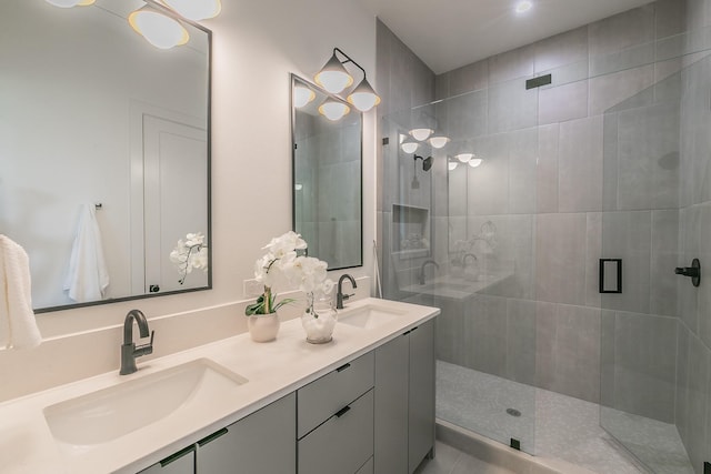 bathroom featuring walk in shower and vanity